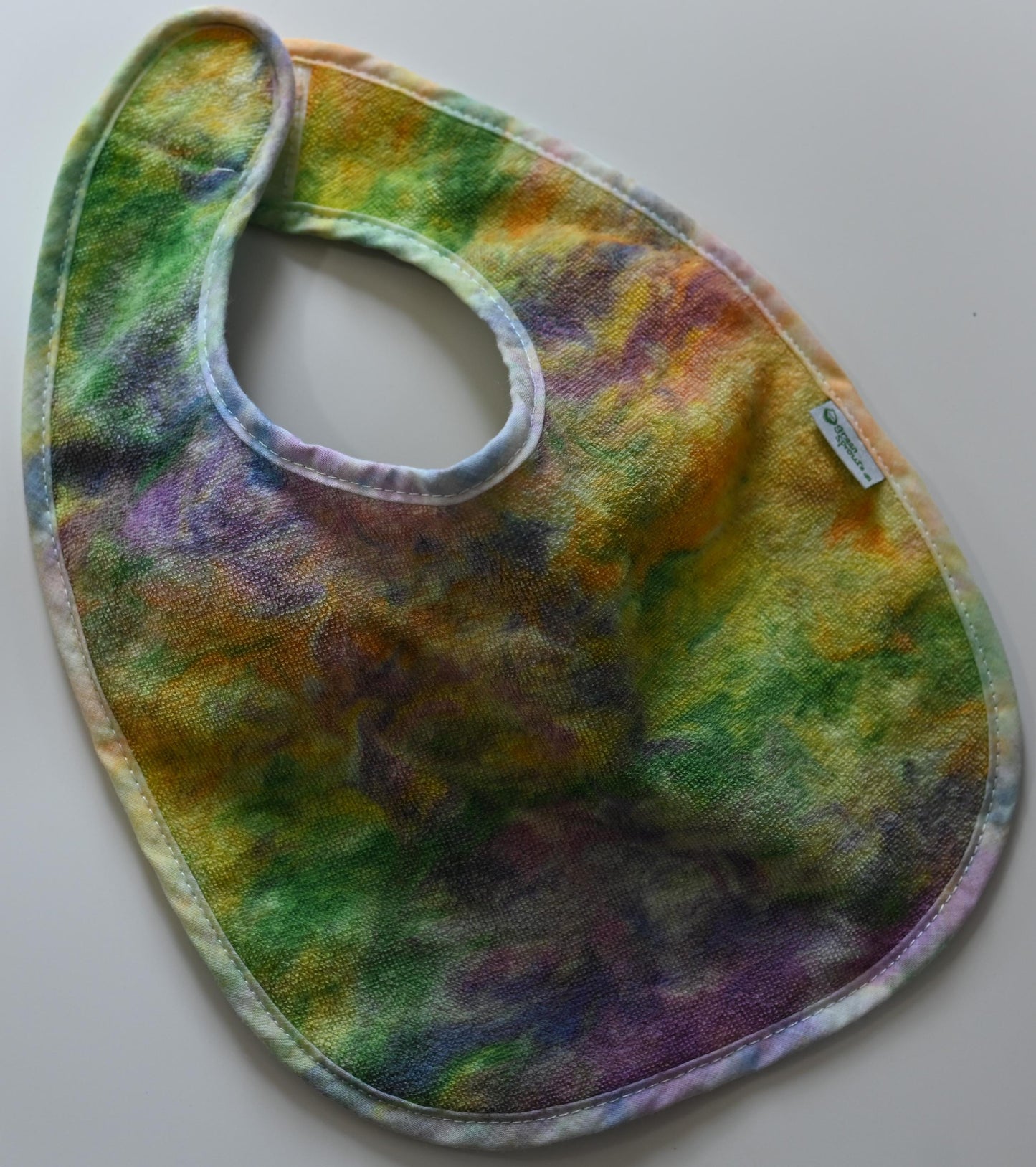 3-12 Months Swirl Dye/Shaving Cream Dye on a Green Sprouts Baby Bib