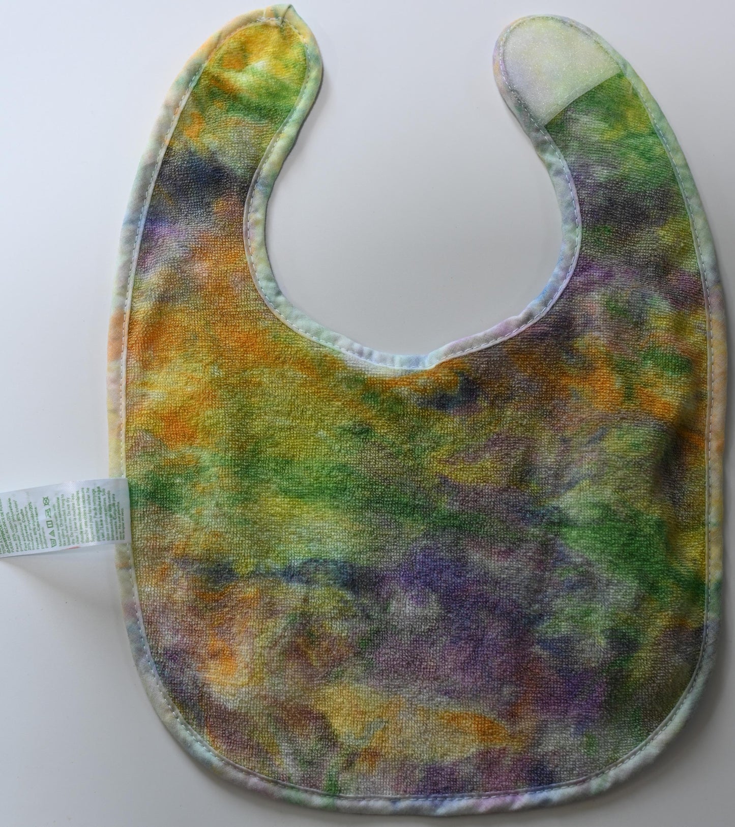 3-12 Months Swirl Dye/Shaving Cream Dye on a Green Sprouts Baby Bib