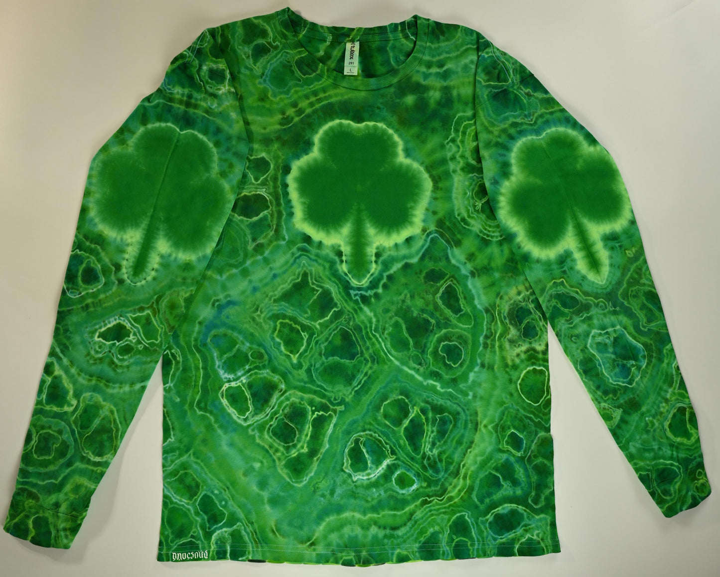Large Shamrocks Front and Sleeves/Triangle UV-DNA Back/Geodes w/ UV Reactive Accents Tie Dye on a Tultex 291 Ringspun Cotton Lng Slv Shirt