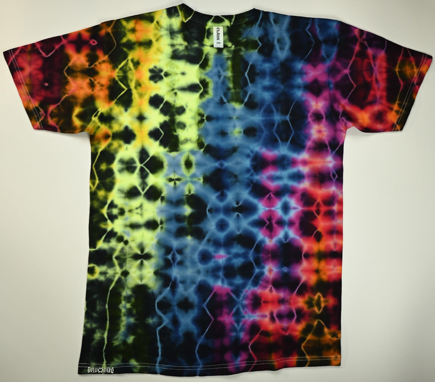 Medium Glitch UV Reactive Tie Dye on a Tultex 290 Ringspun Cotton T-Shirt