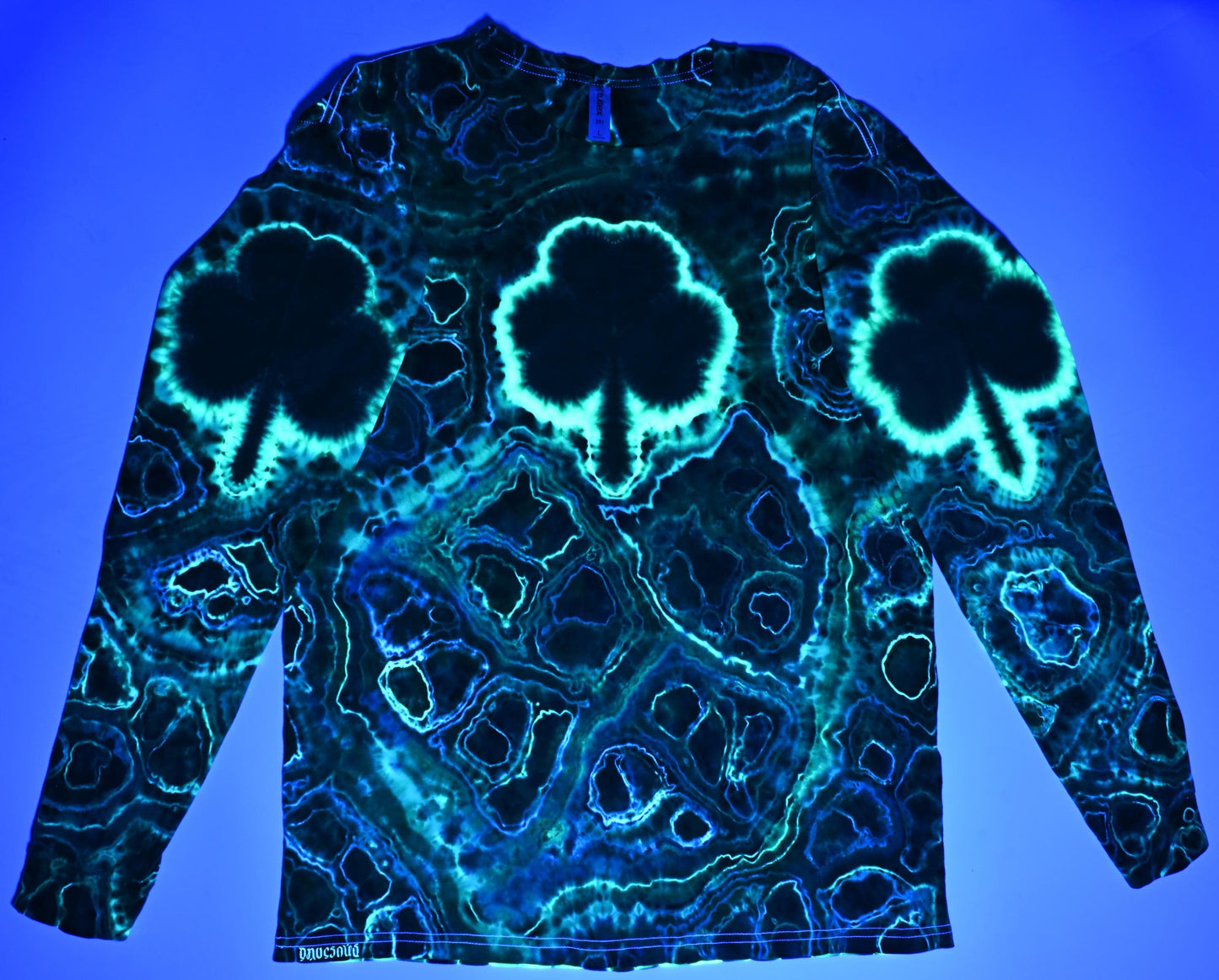 Large Shamrocks Front and Sleeves/Triangle UV-DNA Back/Geodes w/ UV Reactive Accents Tie Dye on a Tultex 291 Ringspun Cotton Lng Slv Shirt