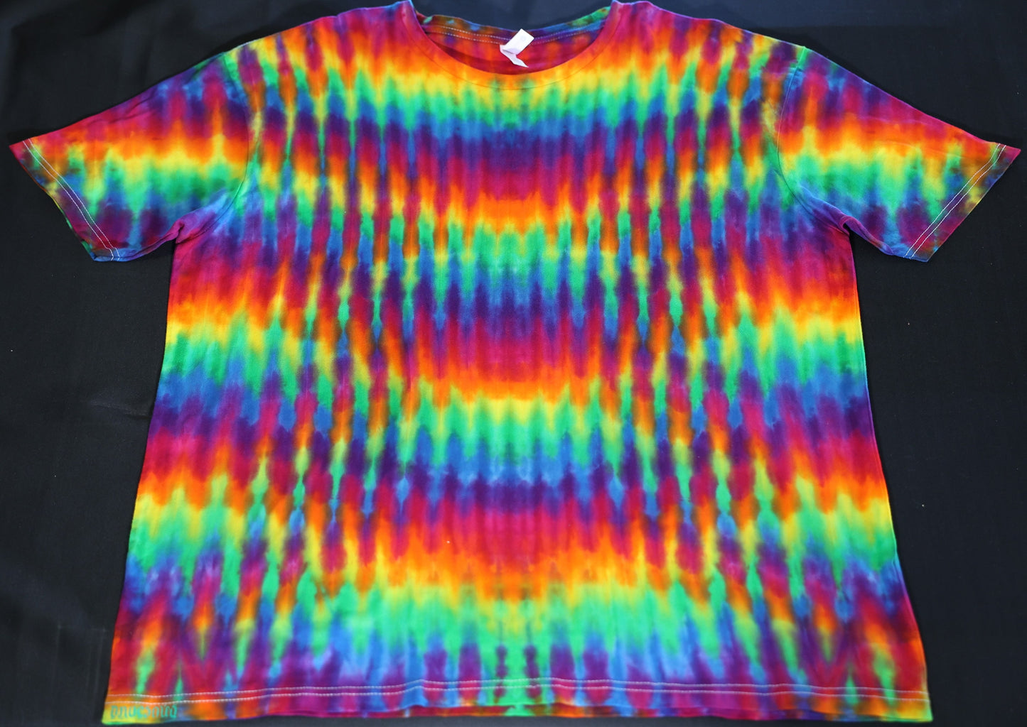 2X Trippy Weaver Vertical Pleat Tie Dye on a Next Level Lightweight Cotton T-Shirt