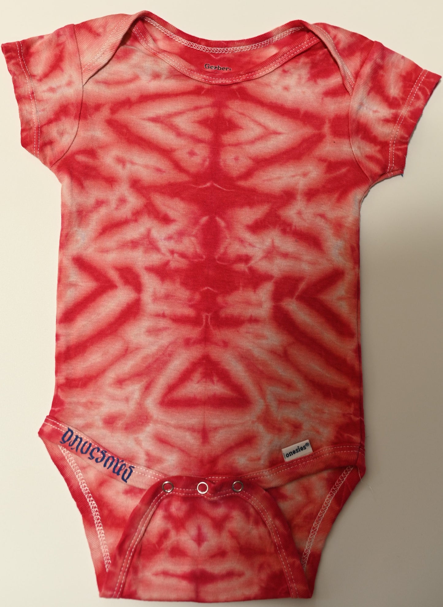 12 Month Scrunch in Pink and Red Tie Dye on a Gerber Cotton Onesie