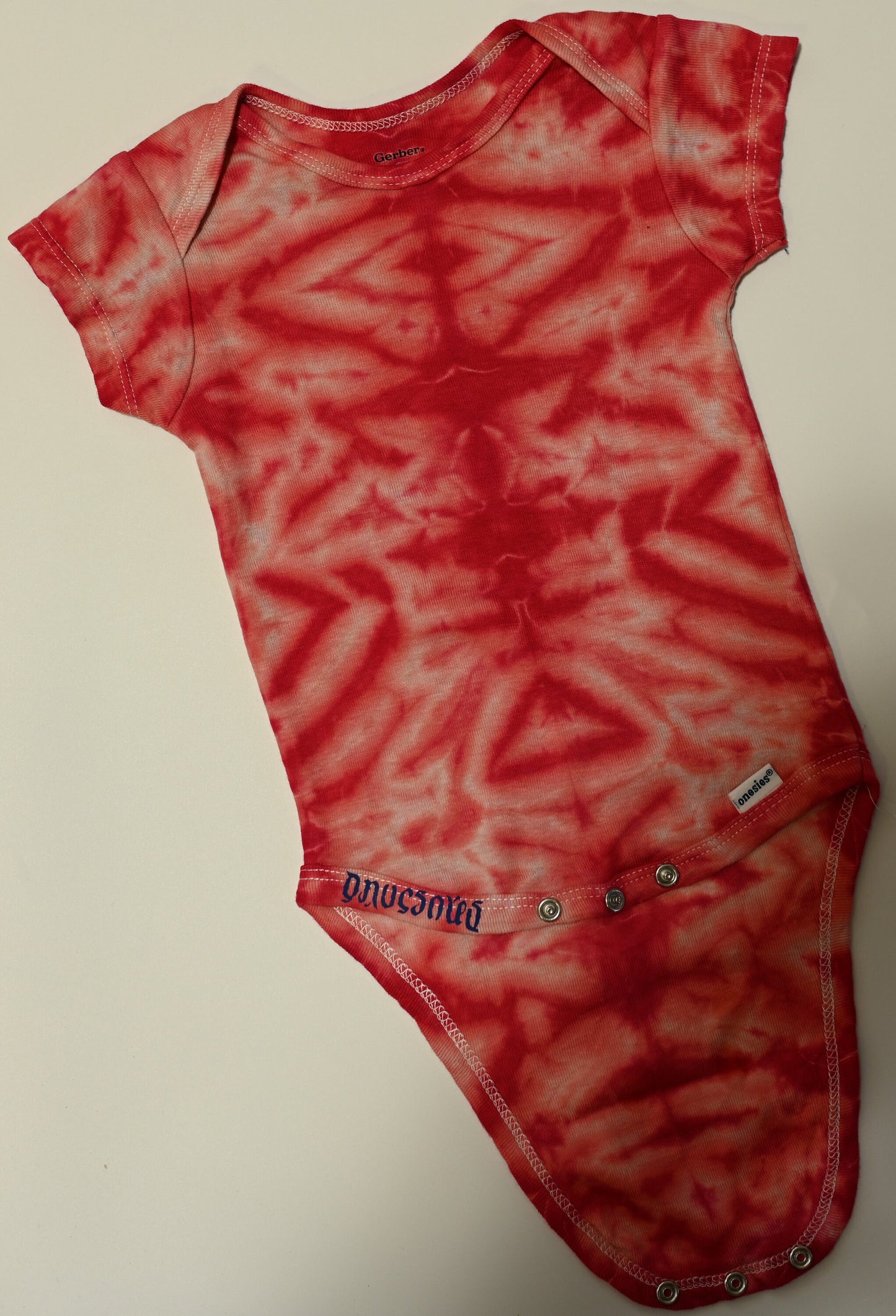 12 Month Scrunch in Pink and Red Tie Dye on a Gerber Cotton Onesie