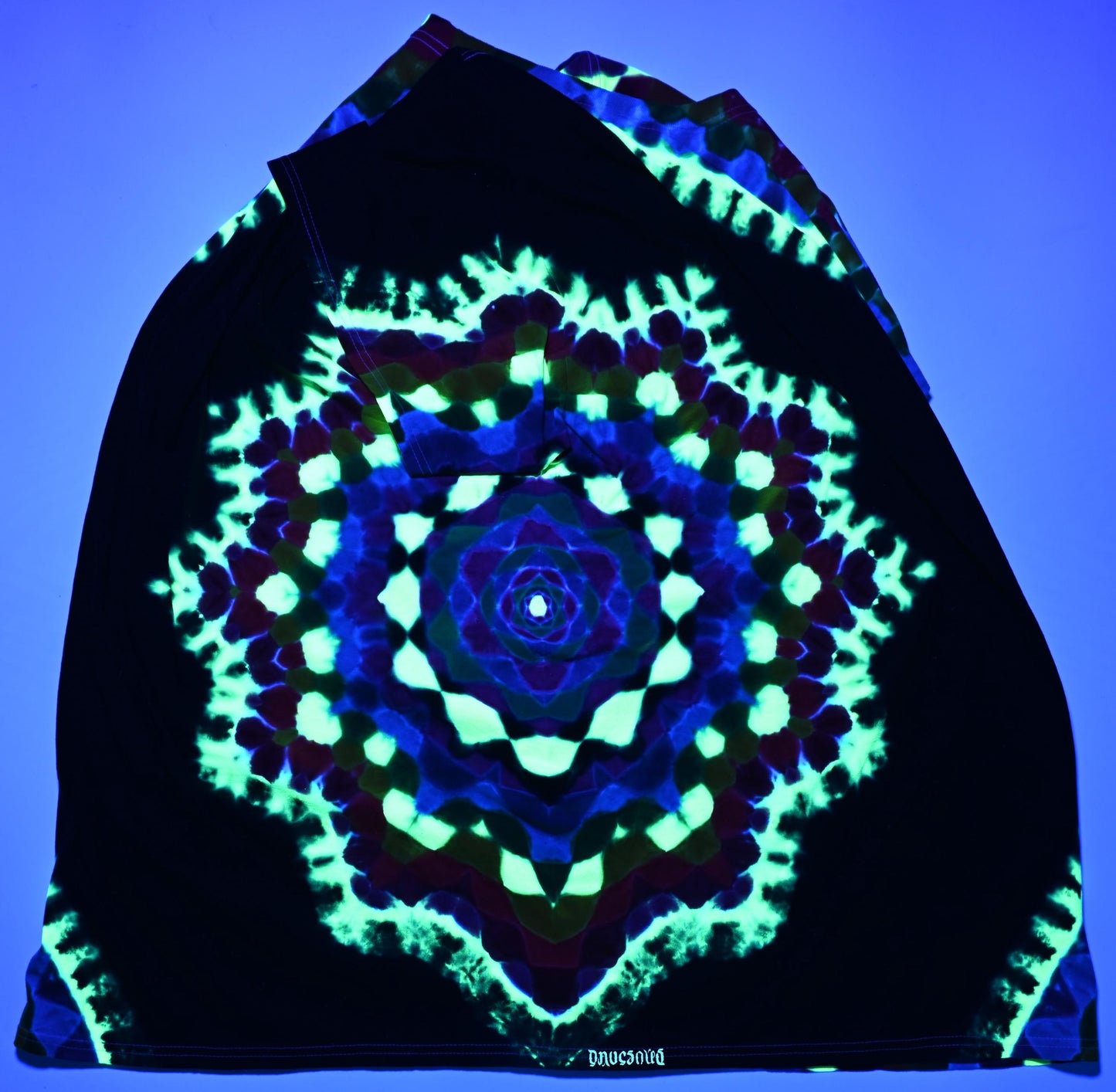 4X UV Reactive Side Hexagon (Gemstone Colors)-> {12/3} Dodecagram/Pac-Man Honeycomb/Black Between Tie Dye on a Port & Company Essential Tee