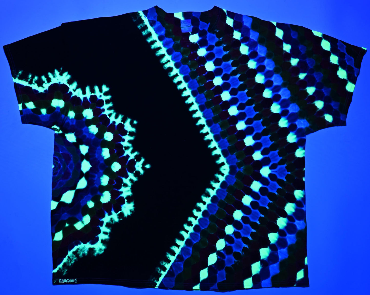 4X UV Reactive Side Hexagon (Gemstone Colors)-> {12/3} Dodecagram/Pac-Man Honeycomb/Black Between Tie Dye on a Port & Company Essential Tee